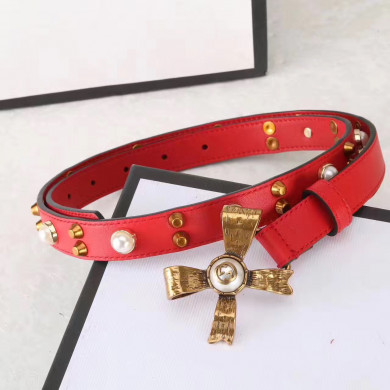 Studded leather belt with metal bow, GUCCI Belts