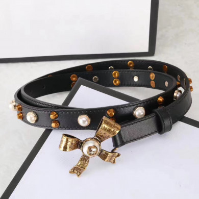 Studded leather belt with metal bow, GUCCI Belts