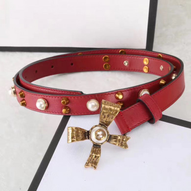Studded leather belt with metal bow, GUCCI Belts