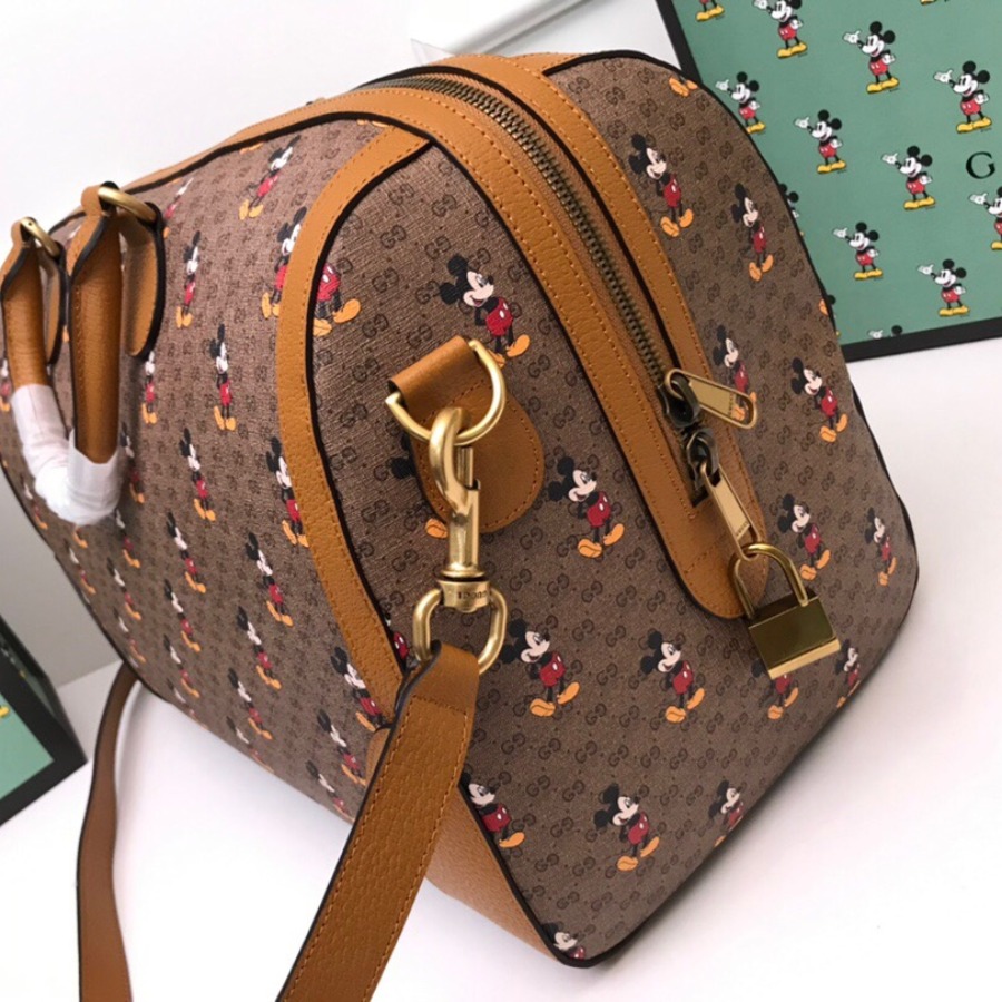 547953 Disney x Gucci medium carry-on duffle