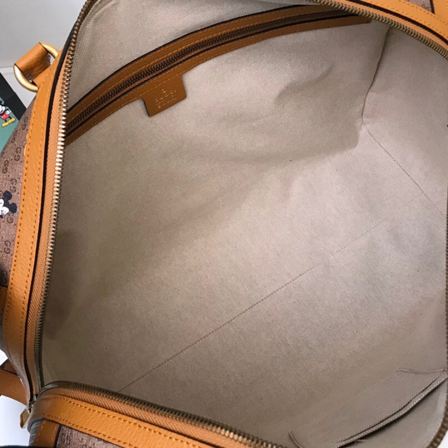 547953 Disney x Gucci medium carry-on duffle