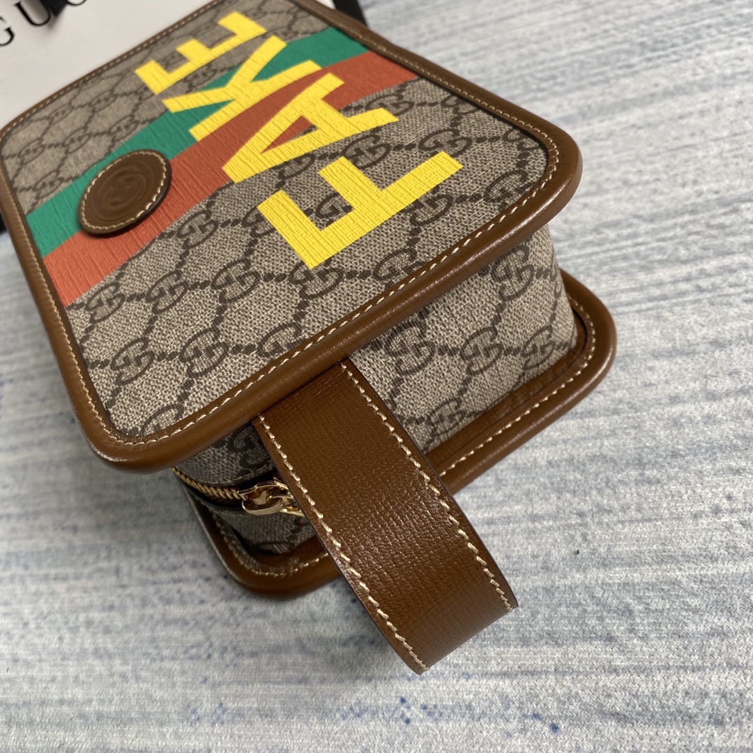 636243  'Fake/Not' print cosmetic case, GUCCI Travel Pouches