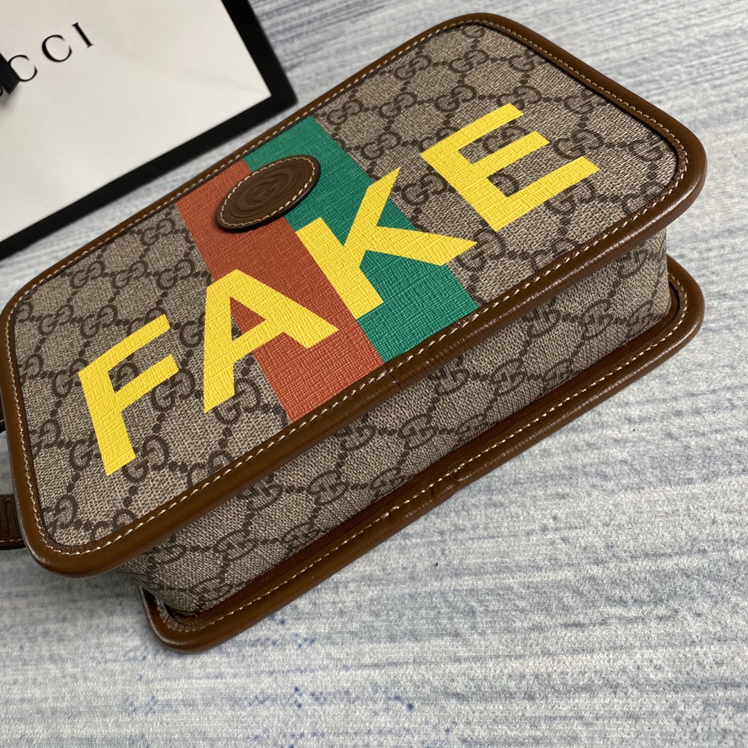 636243  'Fake/Not' print cosmetic case, GUCCI Travel Pouches