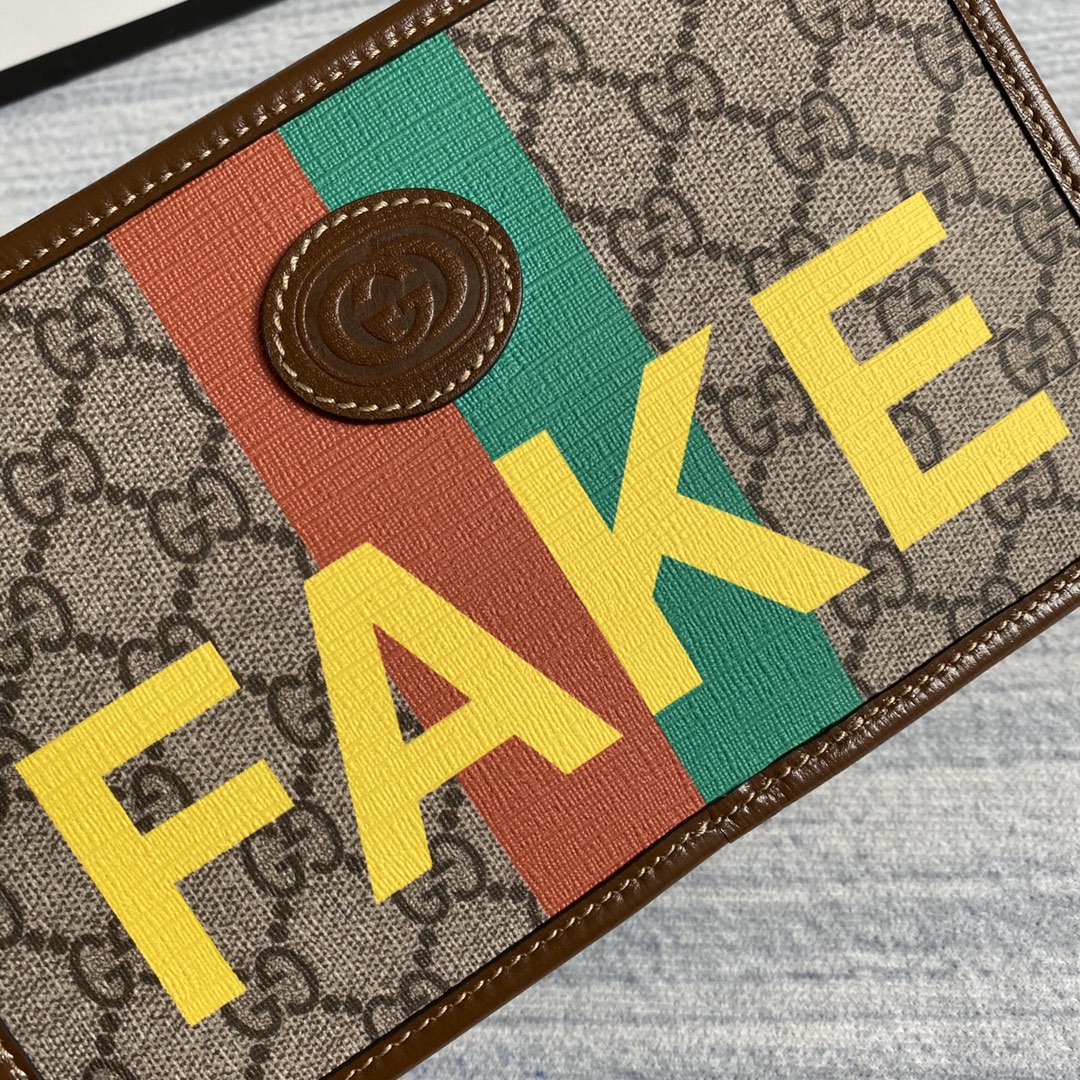 636243  'Fake/Not' print cosmetic case, GUCCI Travel Pouches