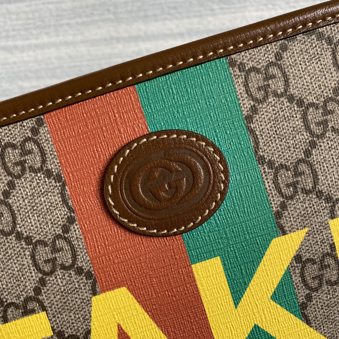 636243  'Fake/Not' print cosmetic case, GUCCI Travel Pouches
