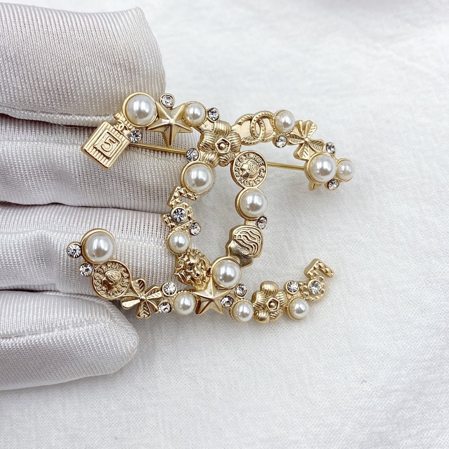 CHANEL BROOCHES