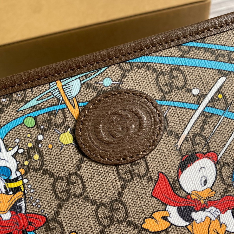 647929  Disney x Gucci Donald Duck cosmetic case