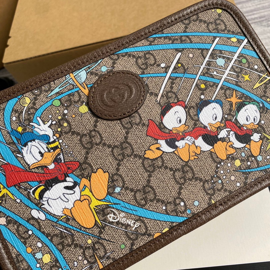 647929  Disney x Gucci Donald Duck cosmetic case