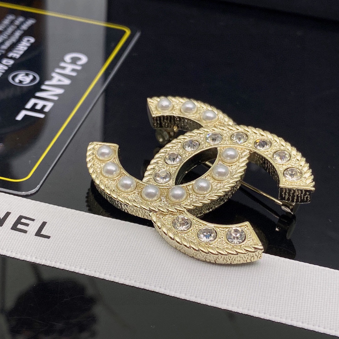 CHANEL BROOCHES