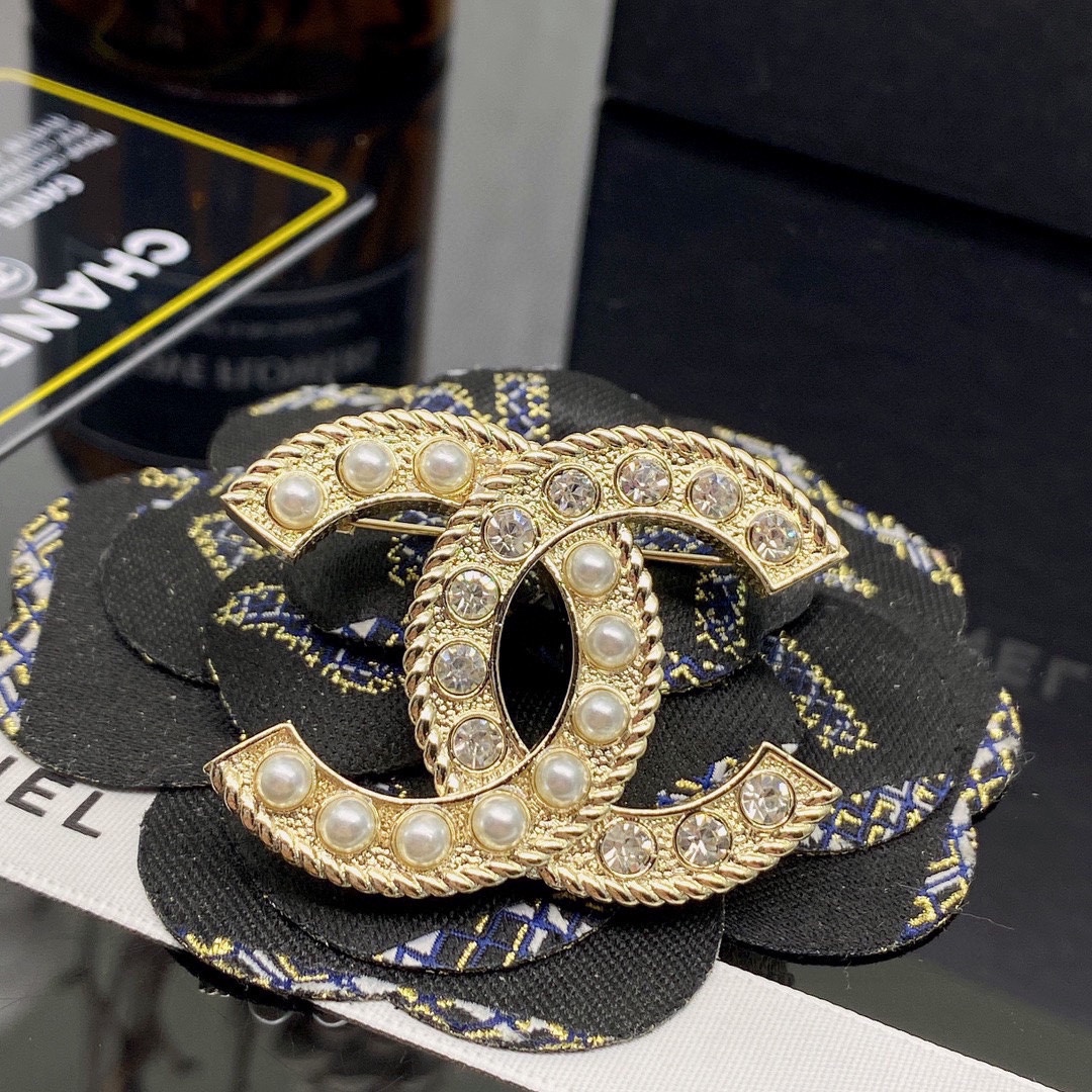 CHANEL BROOCHES