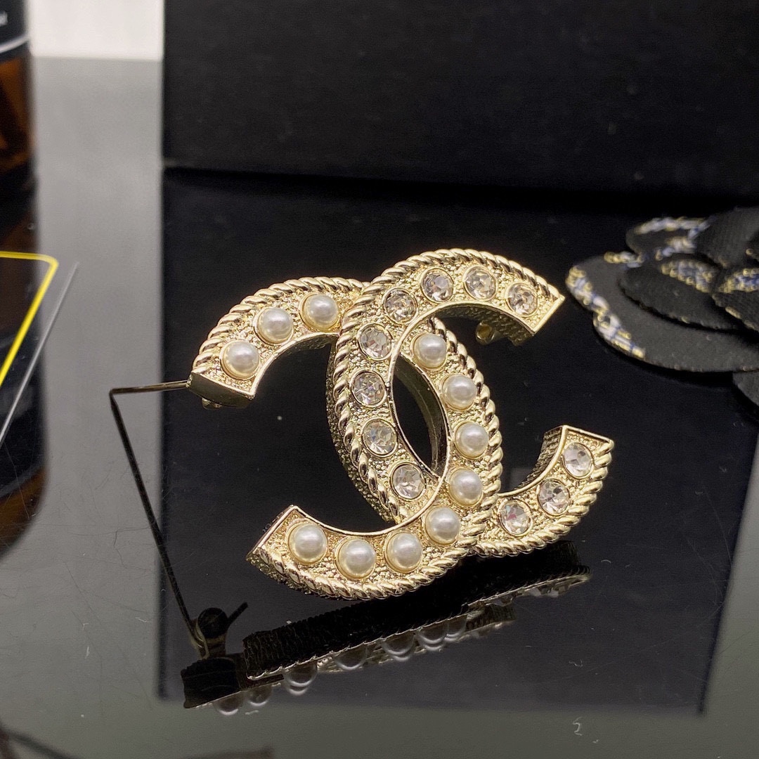 CHANEL BROOCHES