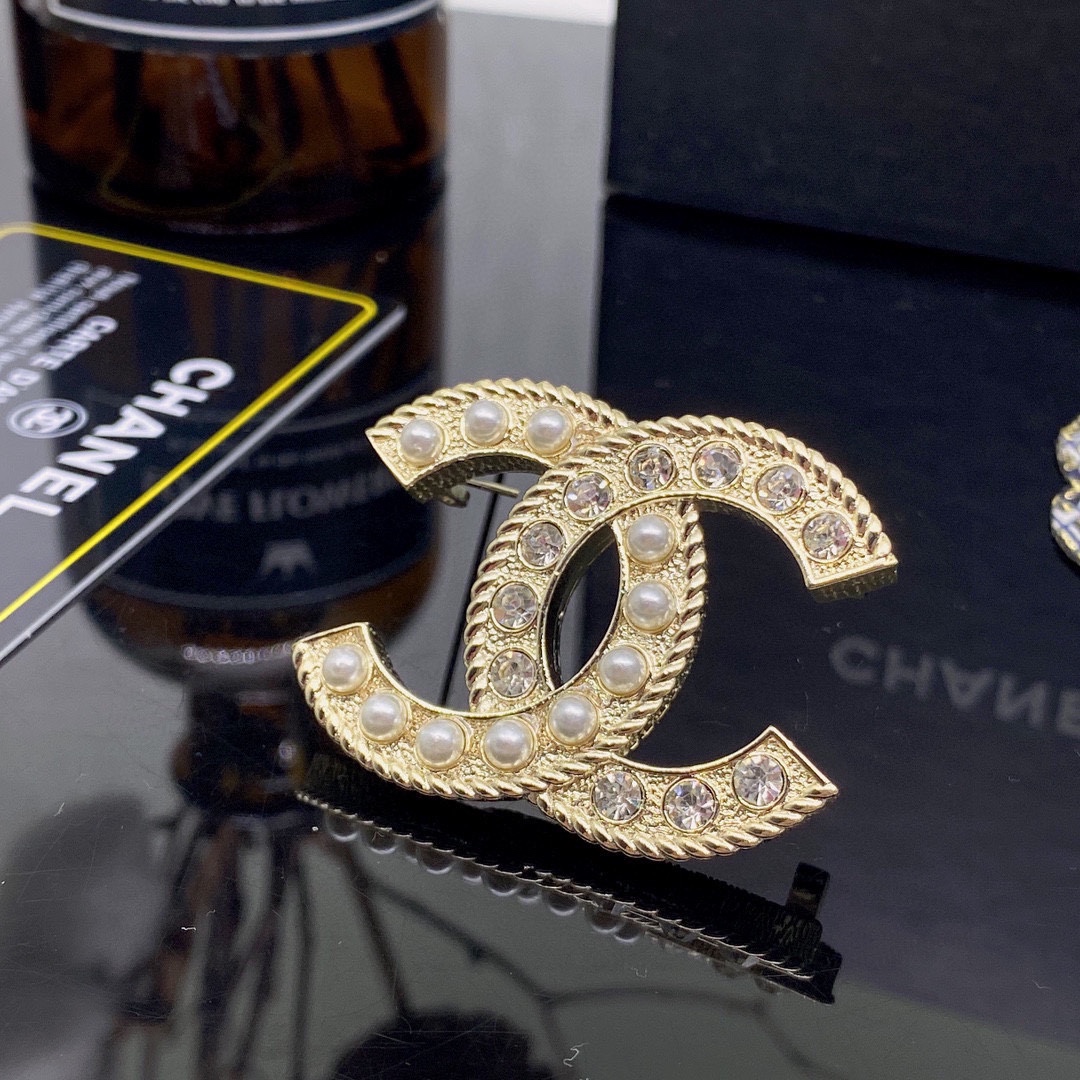 CHANEL BROOCHES