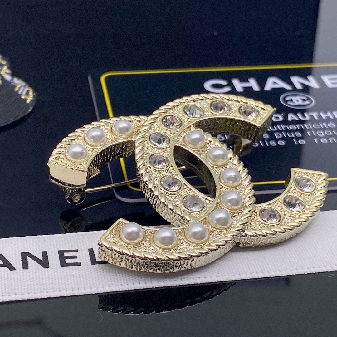 CHANEL BROOCHES