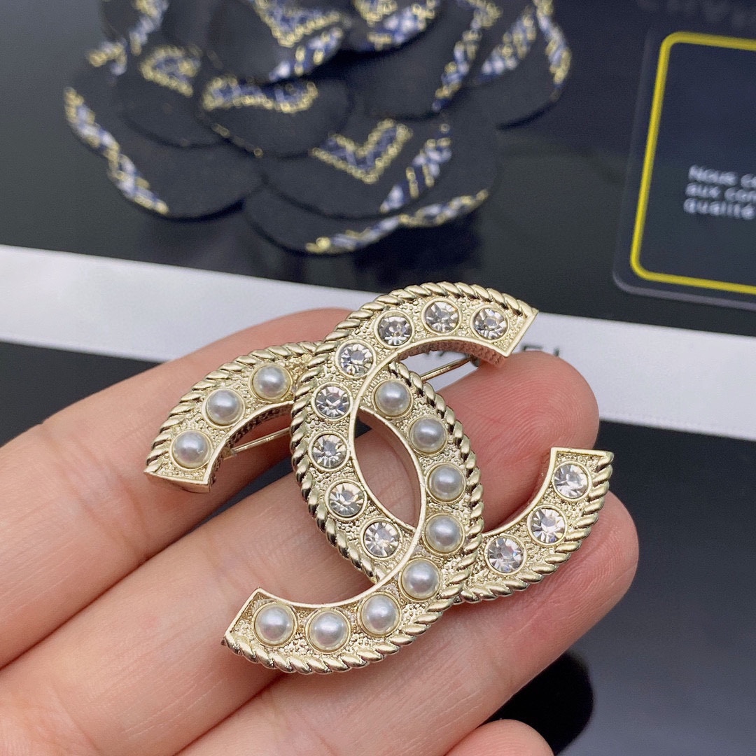 CHANEL BROOCHES