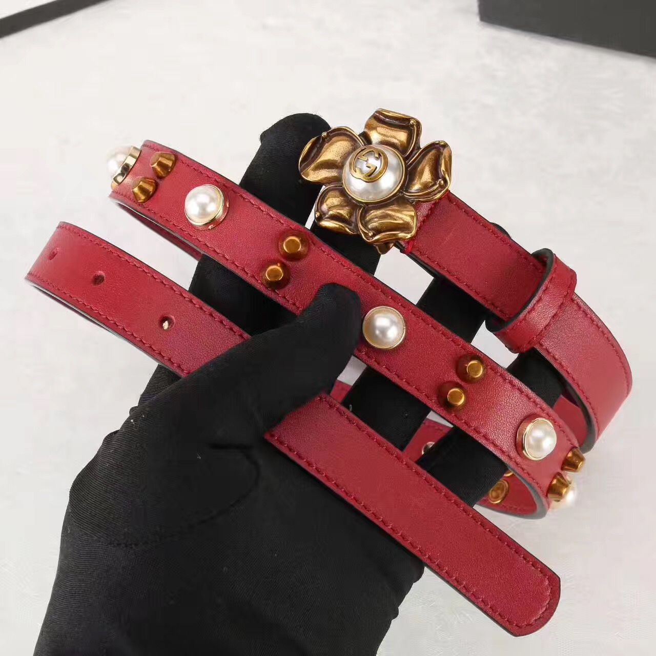 Studded leather belt WITH metal flower, GUCCI Belts