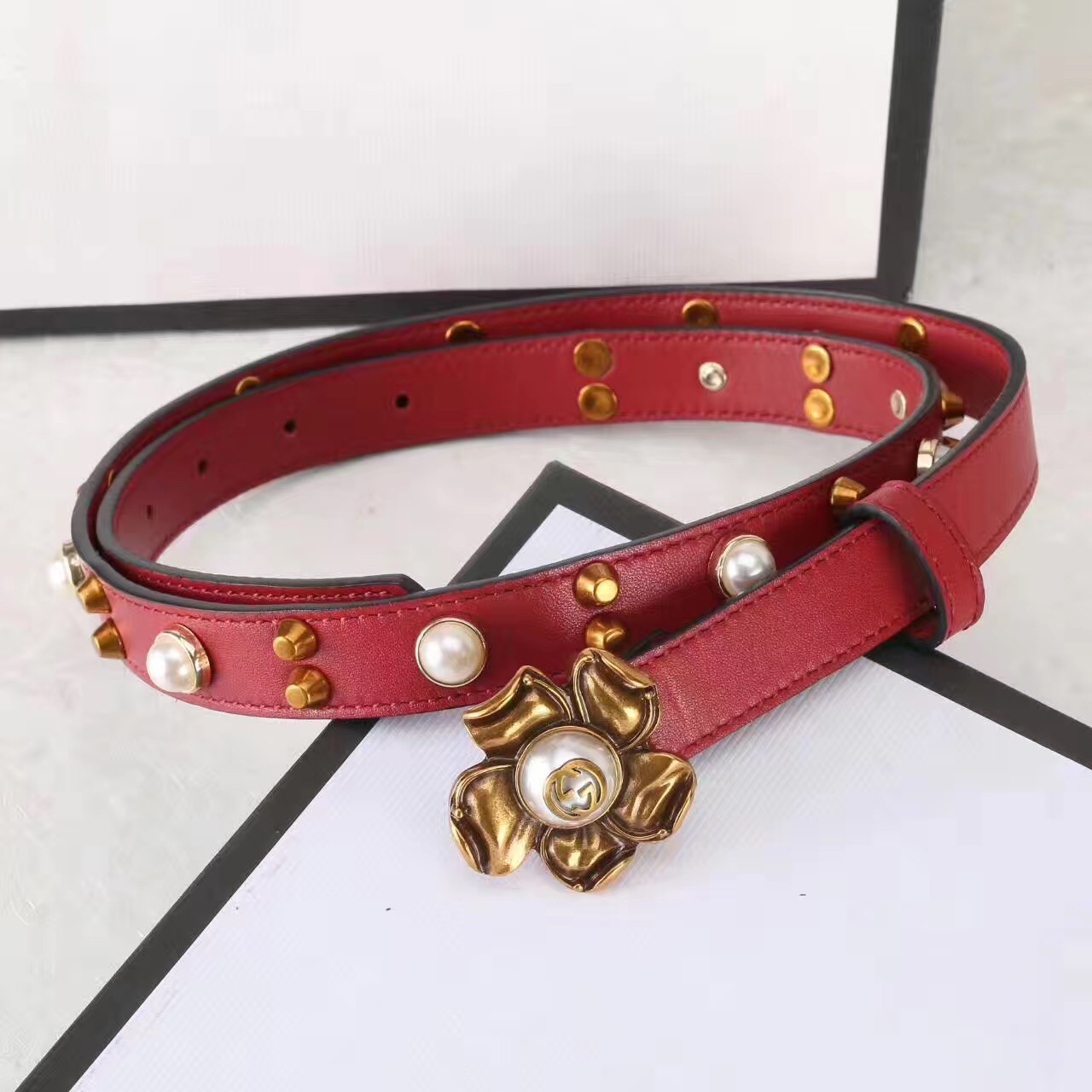 Studded leather belt WITH metal flower, GUCCI Belts