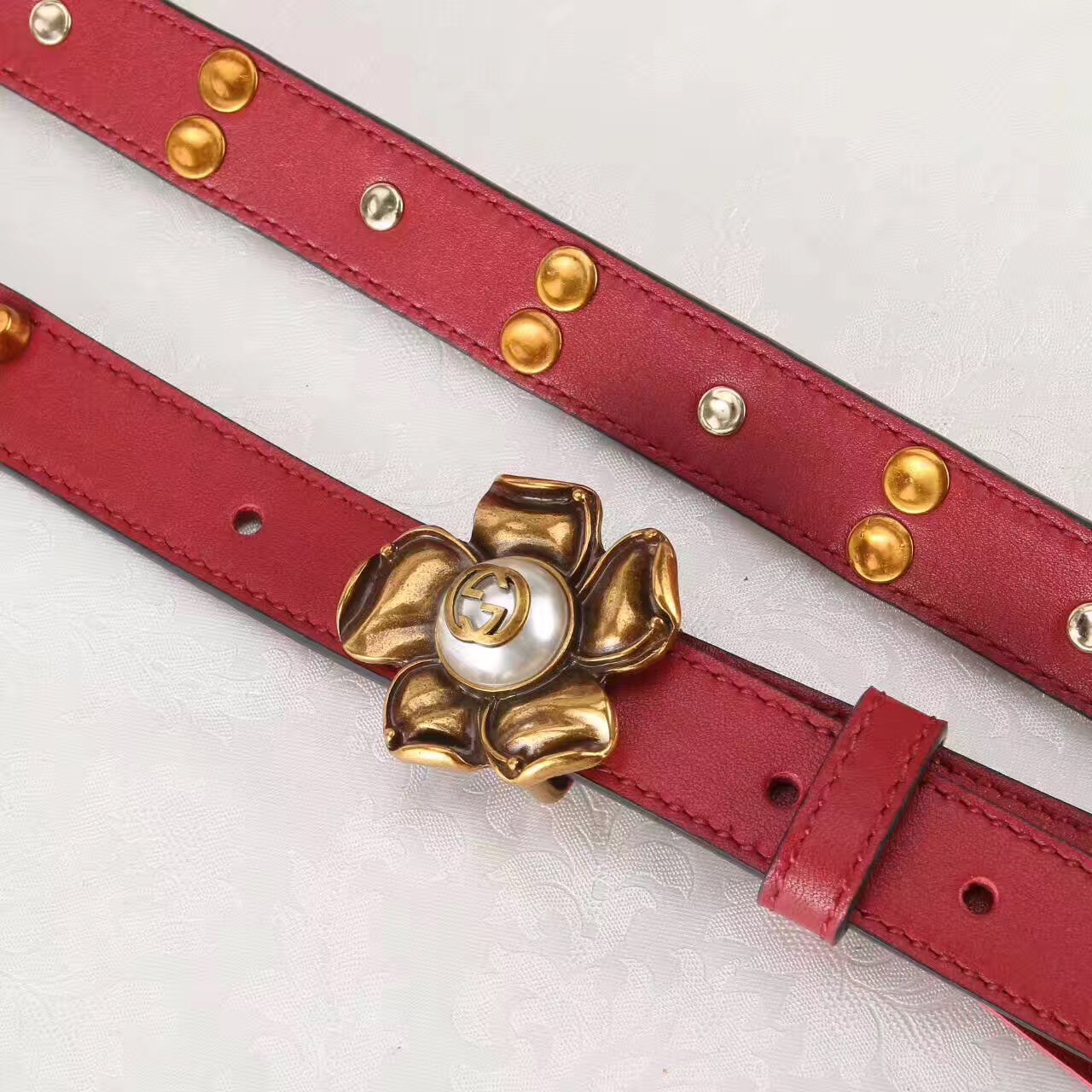 Studded leather belt WITH metal flower, GUCCI Belts