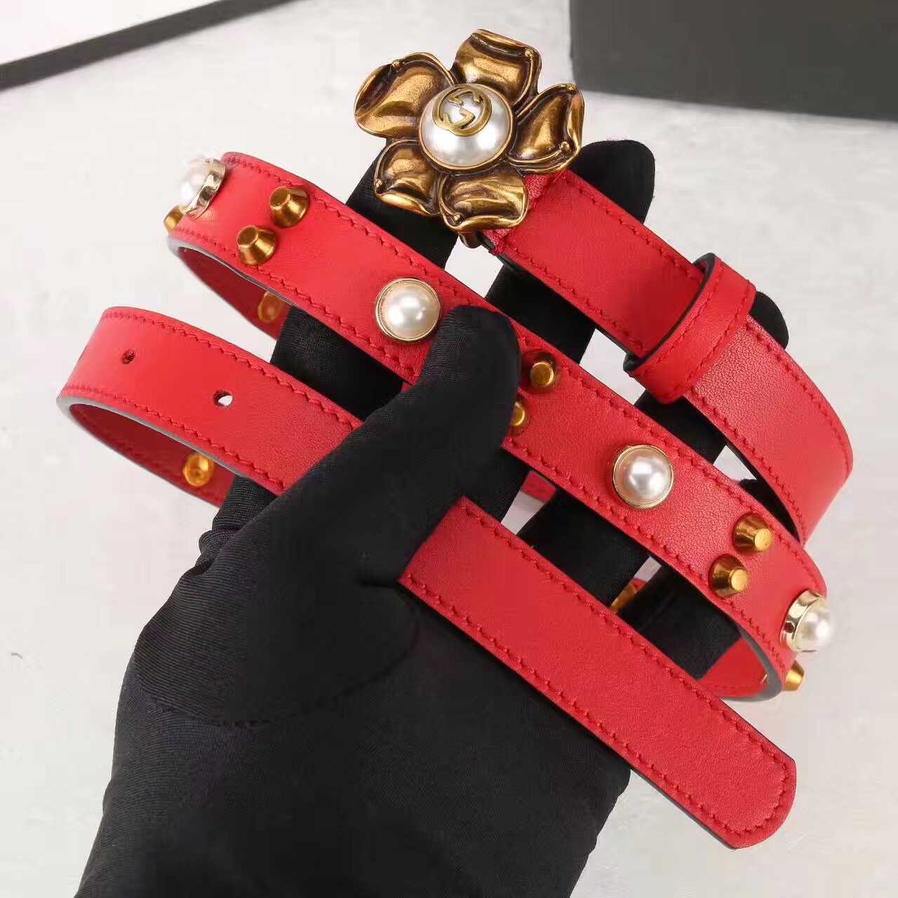 Studded leather belt WITH metal flower, GUCCI Belts