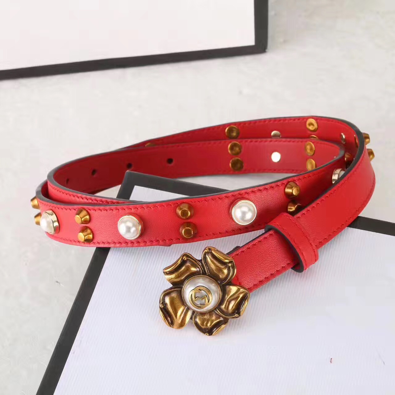 Studded leather belt WITH metal flower, GUCCI Belts