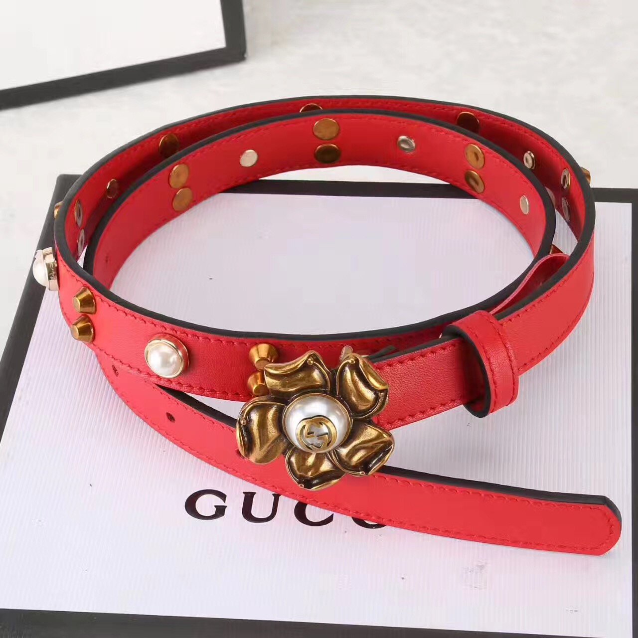 Studded leather belt WITH metal flower, GUCCI Belts