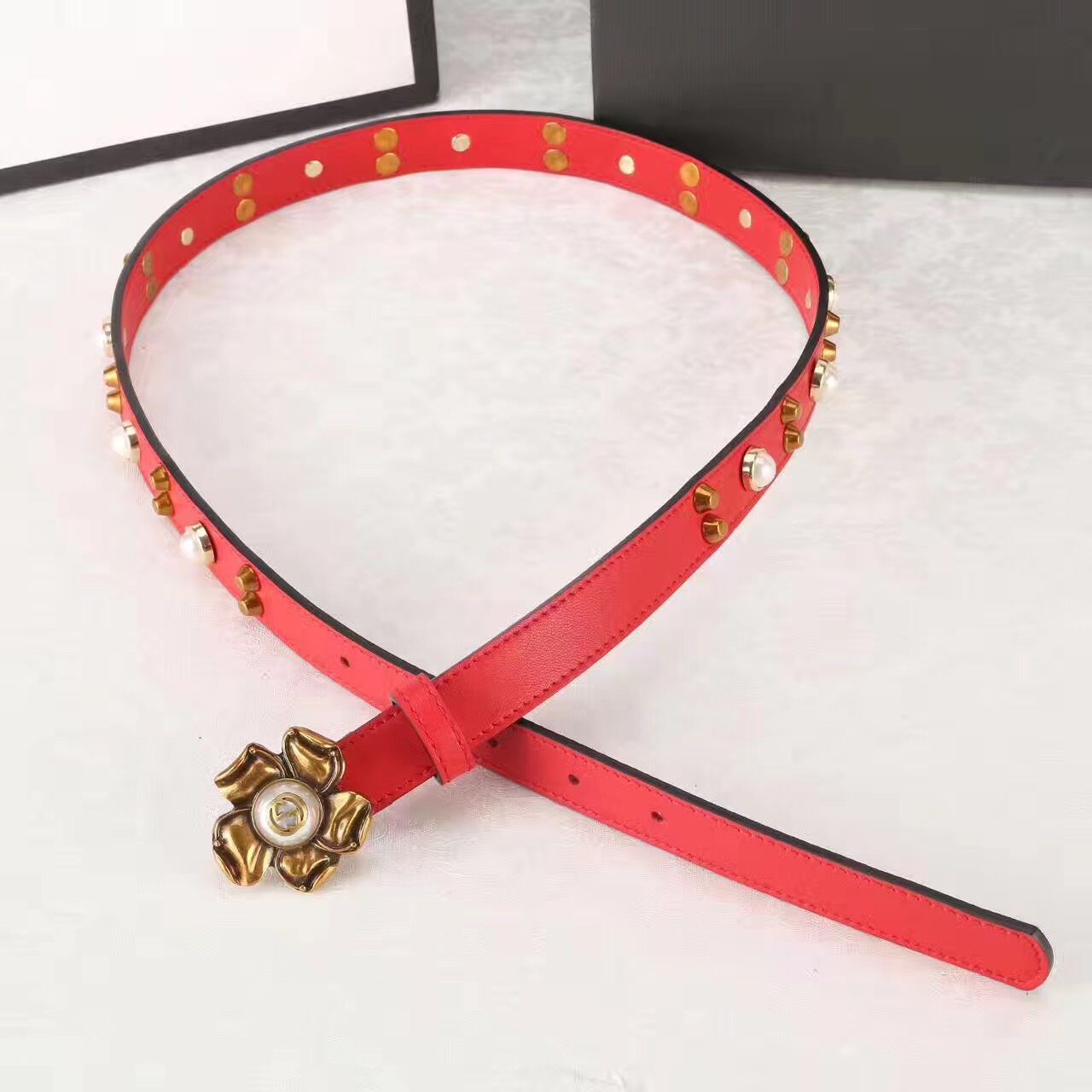 Studded leather belt WITH metal flower, GUCCI Belts