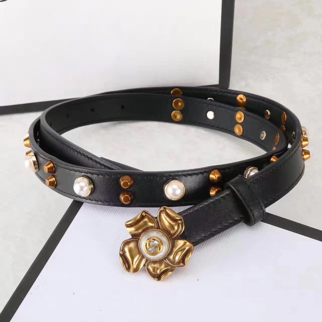 Studded leather belt WITH metal flower, GUCCI Belts