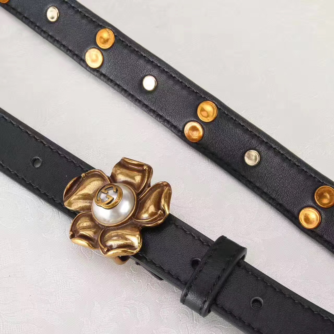 Studded leather belt WITH metal flower, GUCCI Belts