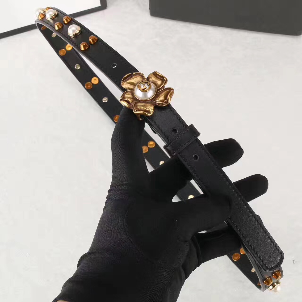 Studded leather belt WITH metal flower, GUCCI Belts